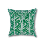 Square throw pillow in a repeating linear block print pattern in green on a mint field.