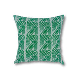 Square throw pillow in a repeating linear block print pattern in green on a mint field.