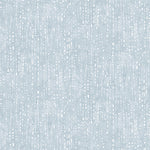 Painterly small-scale dashed dot print in white on a soft blue watercolor field.