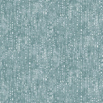 Painterly small-scale dashed dot print in white on a soft peacock blue watercolor field.