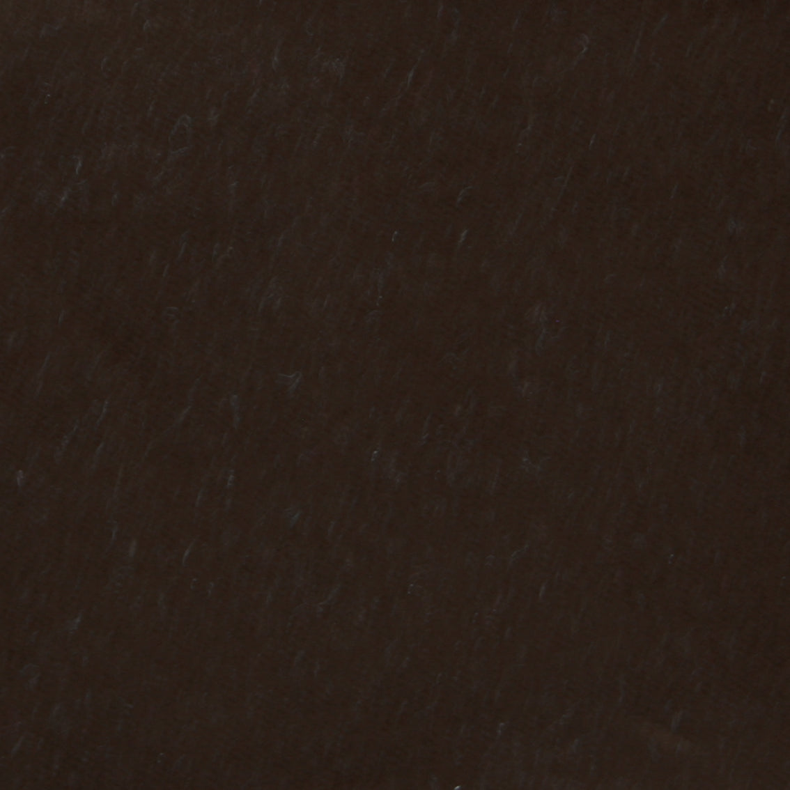 Detail of velvet fabric yardage in dark brown.