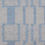 Handwoven rug detail in a dimensional design in blue and beige