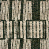 Handwoven rug detail in a dimensional design in green and beige
