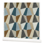 Wallpaper roll with mixed three dimensional diamond forms with black, white, beige, chocolate brown, sky blue and petrol blue on a textured paper.