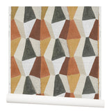 Wallpaper roll with mixed three dimensional diamond forms with black, white, beige, dark rust red, warm orange and ochre yellow on a textured paper.
