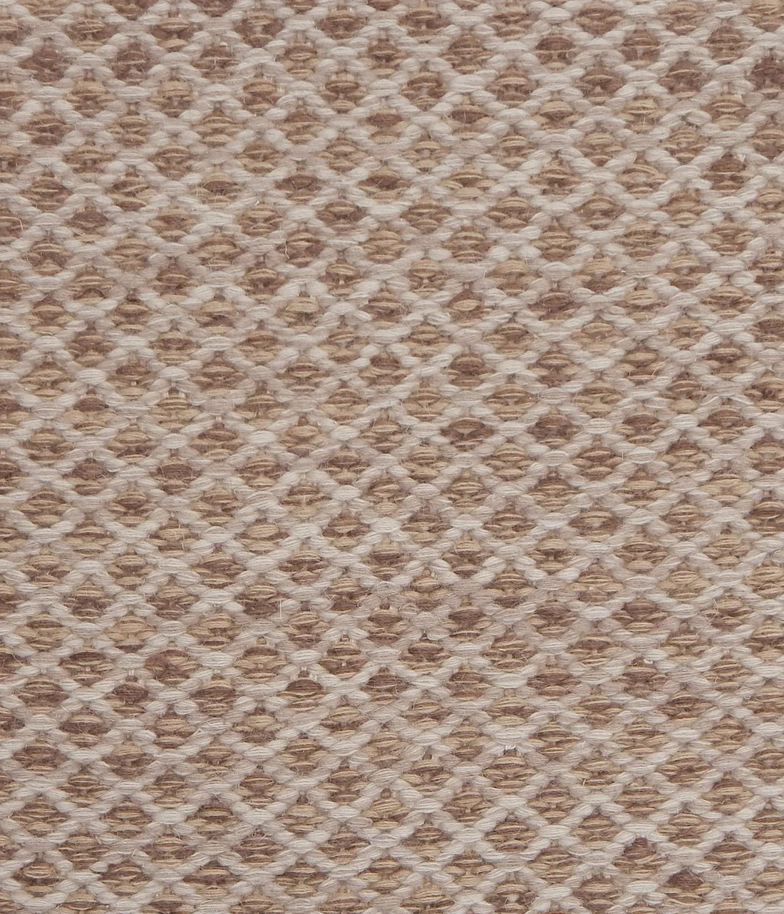 Handwoven rug with small scale diamond lattice in cream on a tan and brown field. 