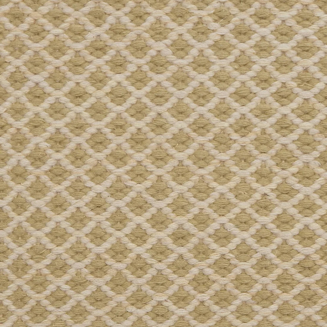 Handwoven rug with small scale diamond lattice in cream on a pale green field. 