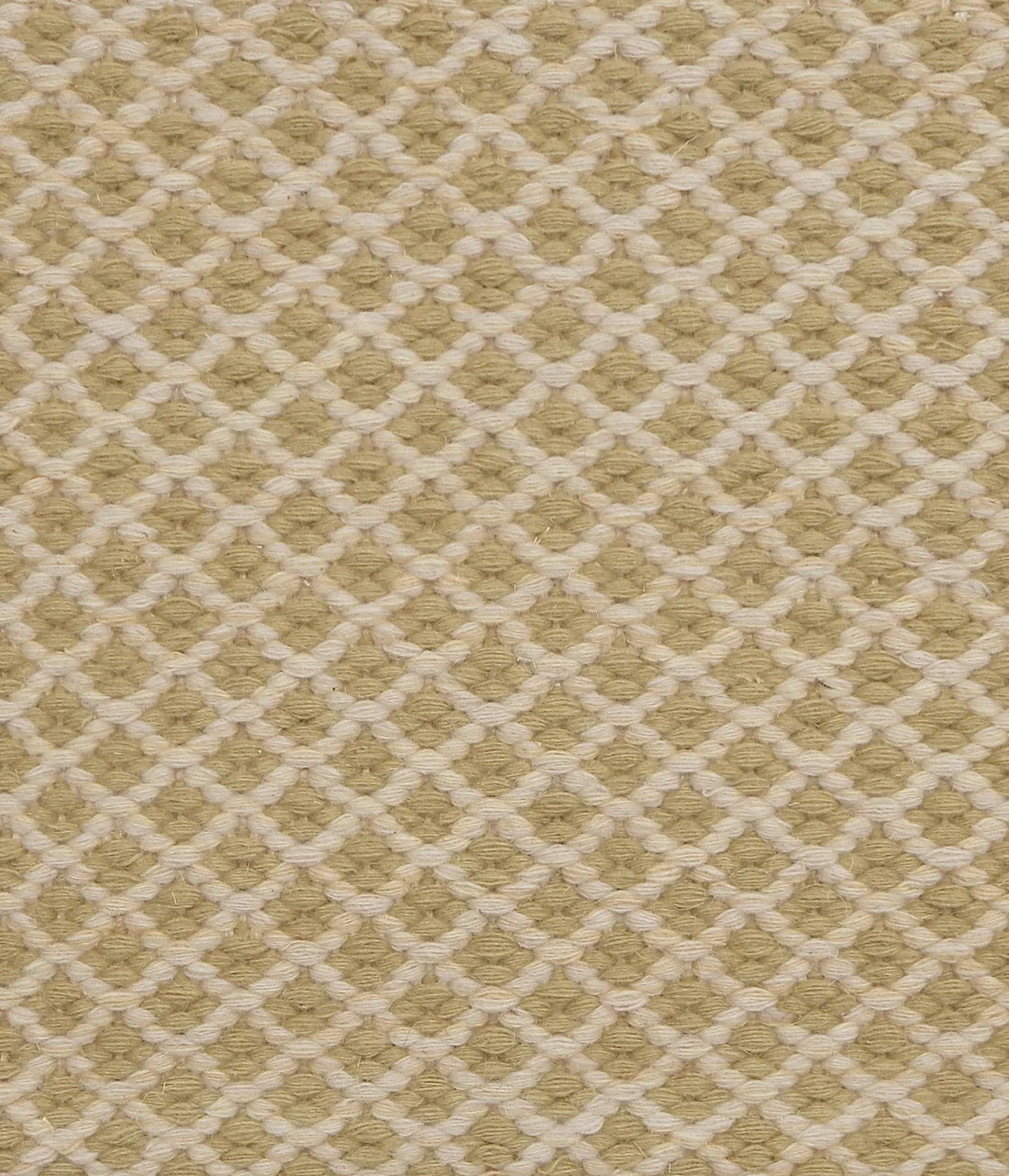 Handwoven rug with small scale diamond lattice in cream on a pale green field. 