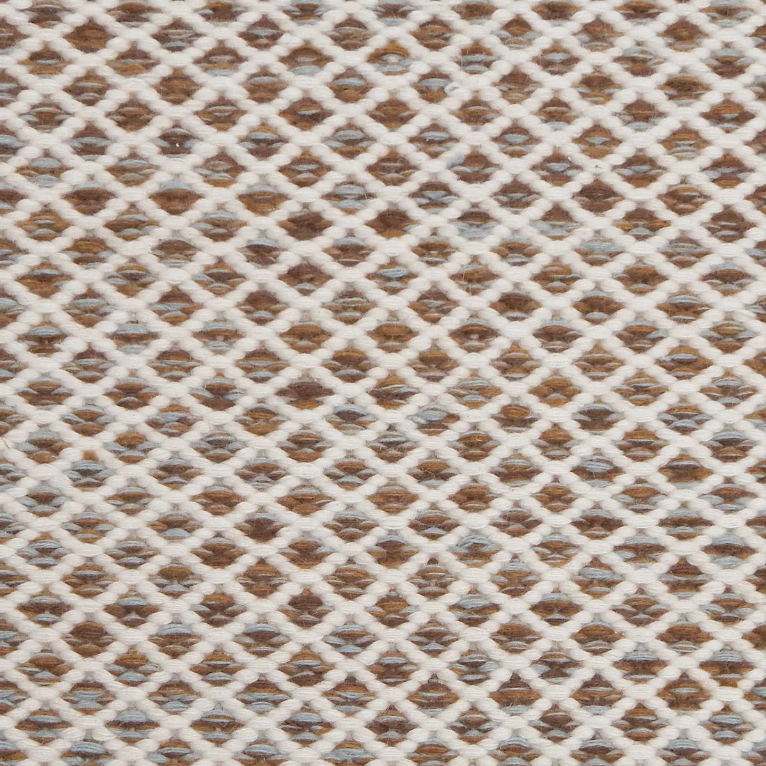 Handwoven rug with small scale diamond lattice in cream on a tan and brown field. 