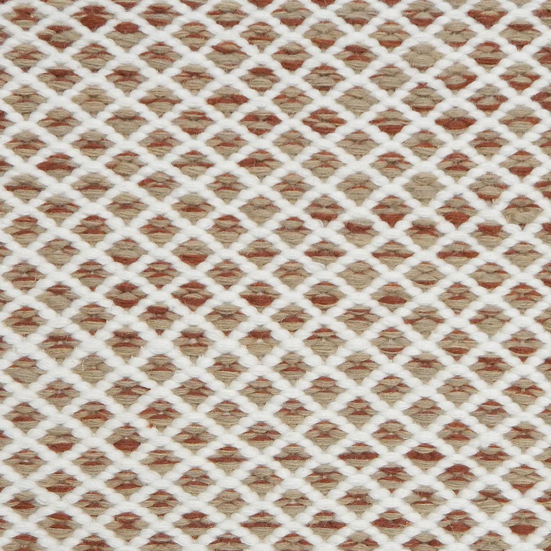 Handwoven rug with small scale diamond lattice in cream on a tan and tan and red field. 