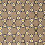 Detail of fabric in a geometric honeycomb pattern in shades of brown, yellow and gray.