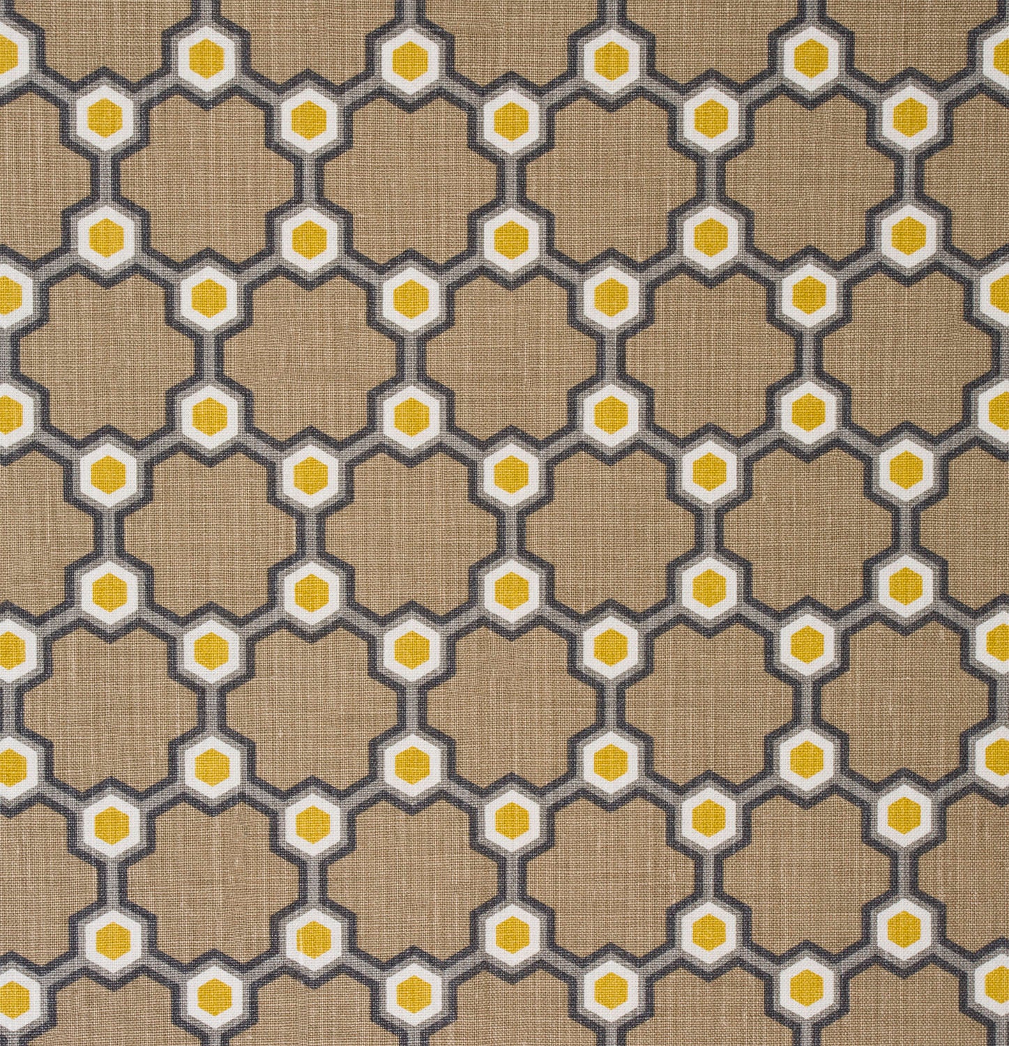 Detail of fabric in a geometric honeycomb pattern in shades of brown, yellow and gray.