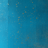 Detail of a wallpaper in a random splattered pattern in metallic gold on a blue field.