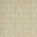 Close up of wallpaper with dashed striped grid in white on tan. 