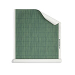 Roll of wallpaper with dashed striped grid in tonal green.