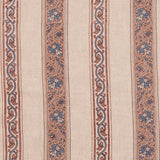 Detail of fabric in a striped paisley print in blue and brown on a cream field.