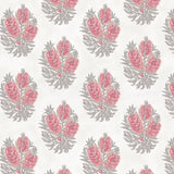 Detail of wallpaper in a floral cameo print in dusty rose and gray on a white field.