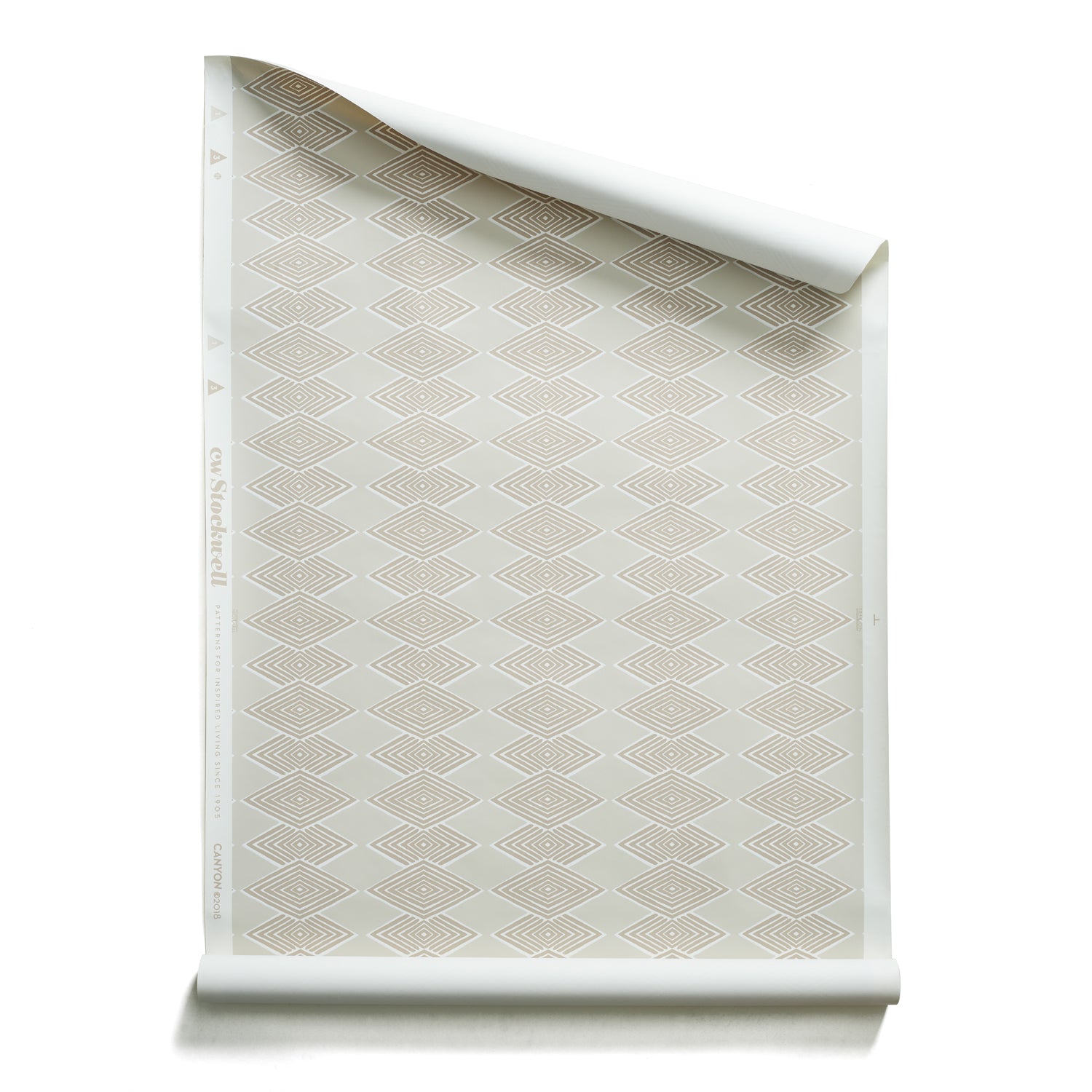 Roll of wallpaper with linear stacked diamond stripe in shades of beige.
