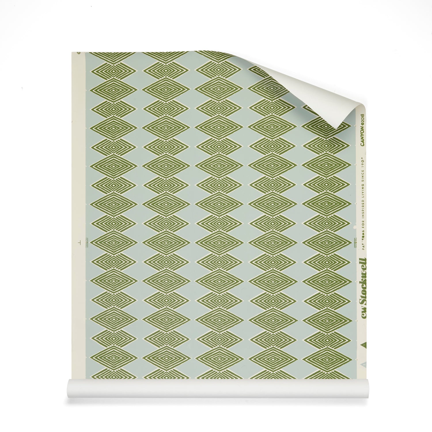 Roll of wallpaper with linear stacked diamond stripe in green on light blue.