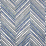 Broadloom carpet with a graphic herringbone pattern in shades of light blue and white. 