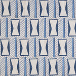 A close-up of a patterned fabric featuring a repeating geometric design of white hourglass-like shapes outlined in blue, set against a light gray background with diagonal blue stripes.