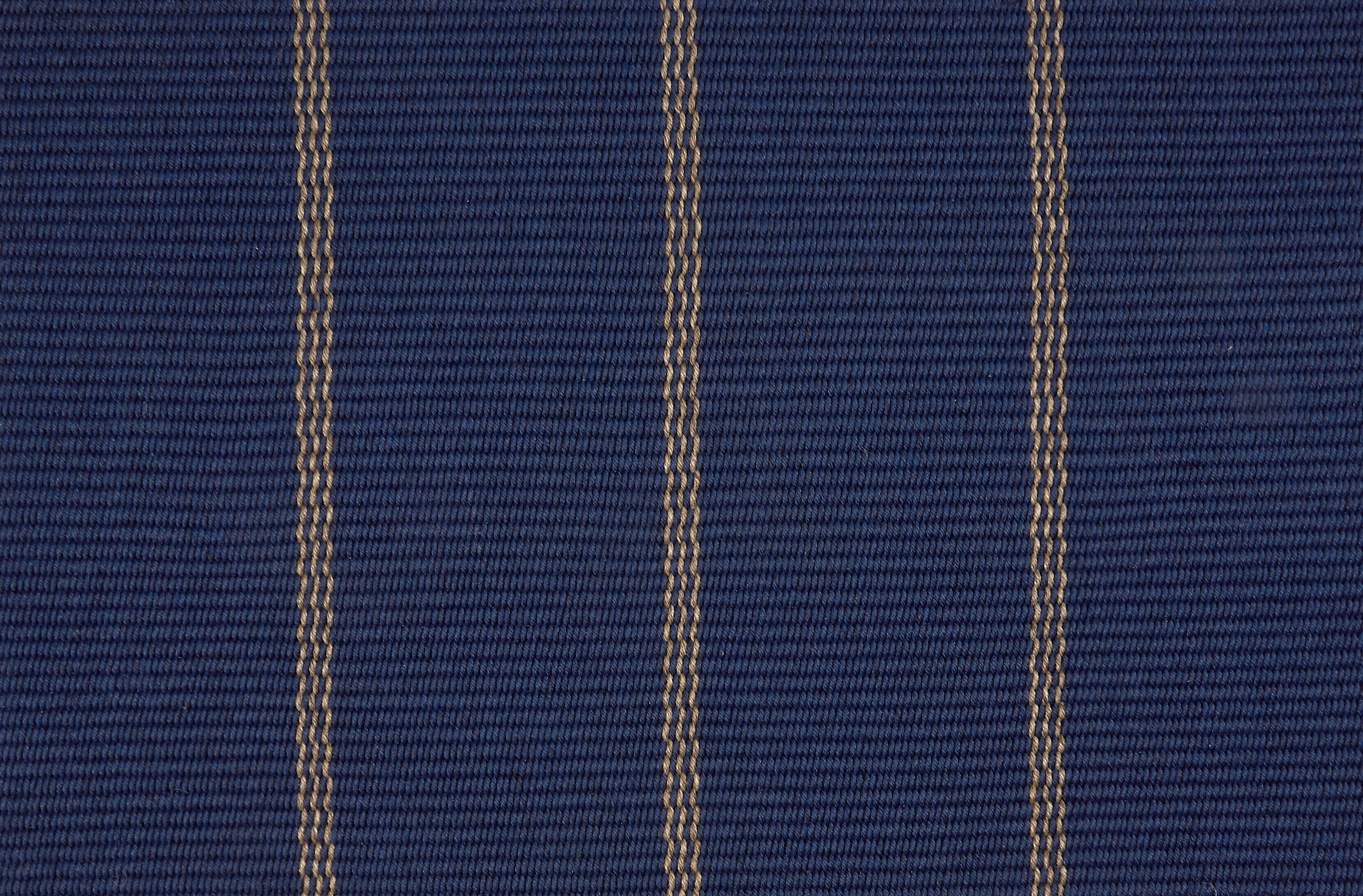 Broadloom carpet in cobalt blue with a tan widely placed pinstripe