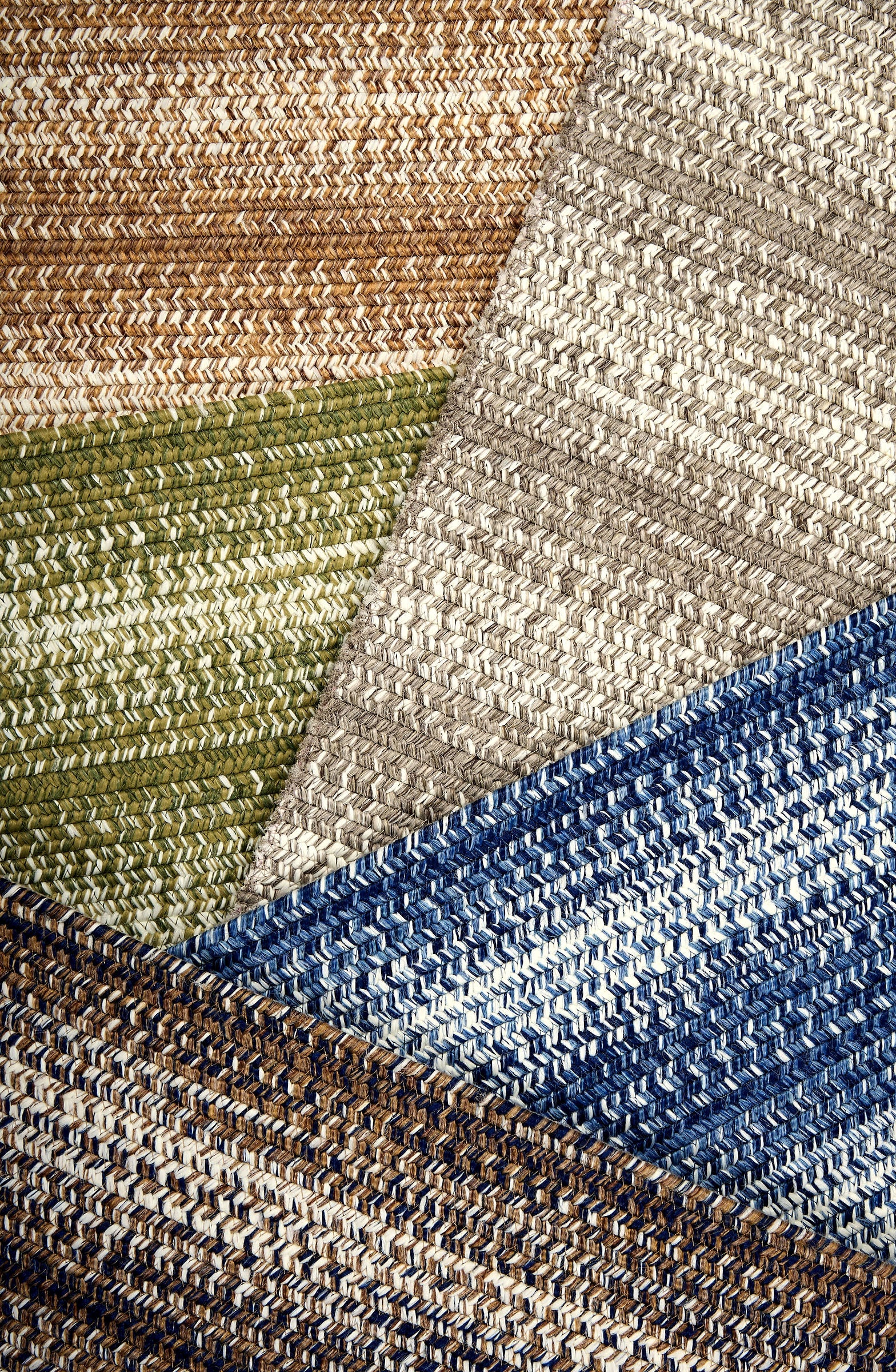 Broadloom carpet swatches in textural braid pattern in various colors. 