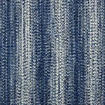 Broadloom carpet in a textural braided stripe in cream and blue.
