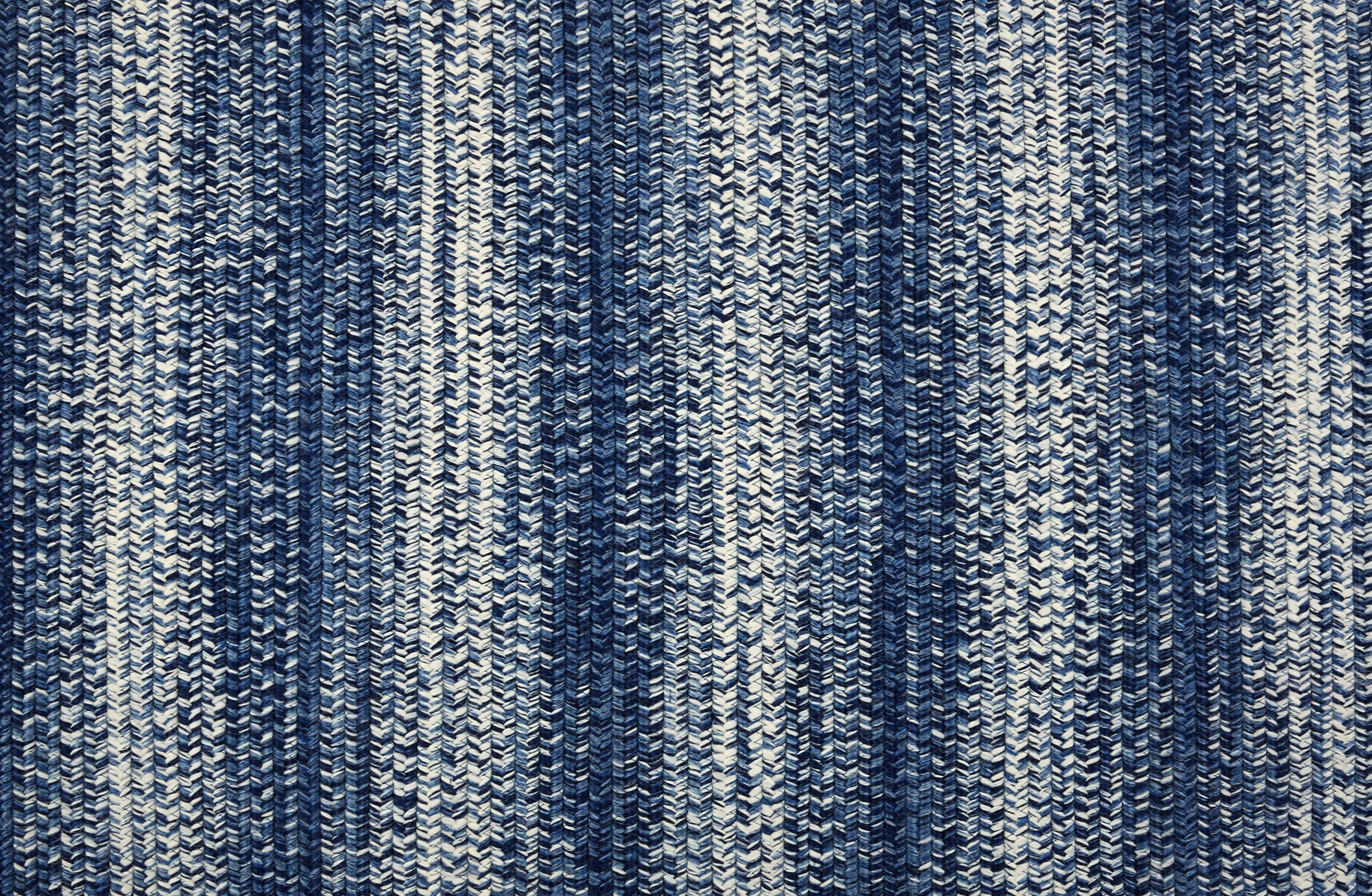 Broadloom carpet in a textural braided stripe in cream and blue.