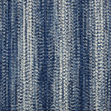 Broadloom carpet in a textural braided stripe in cream and blue.