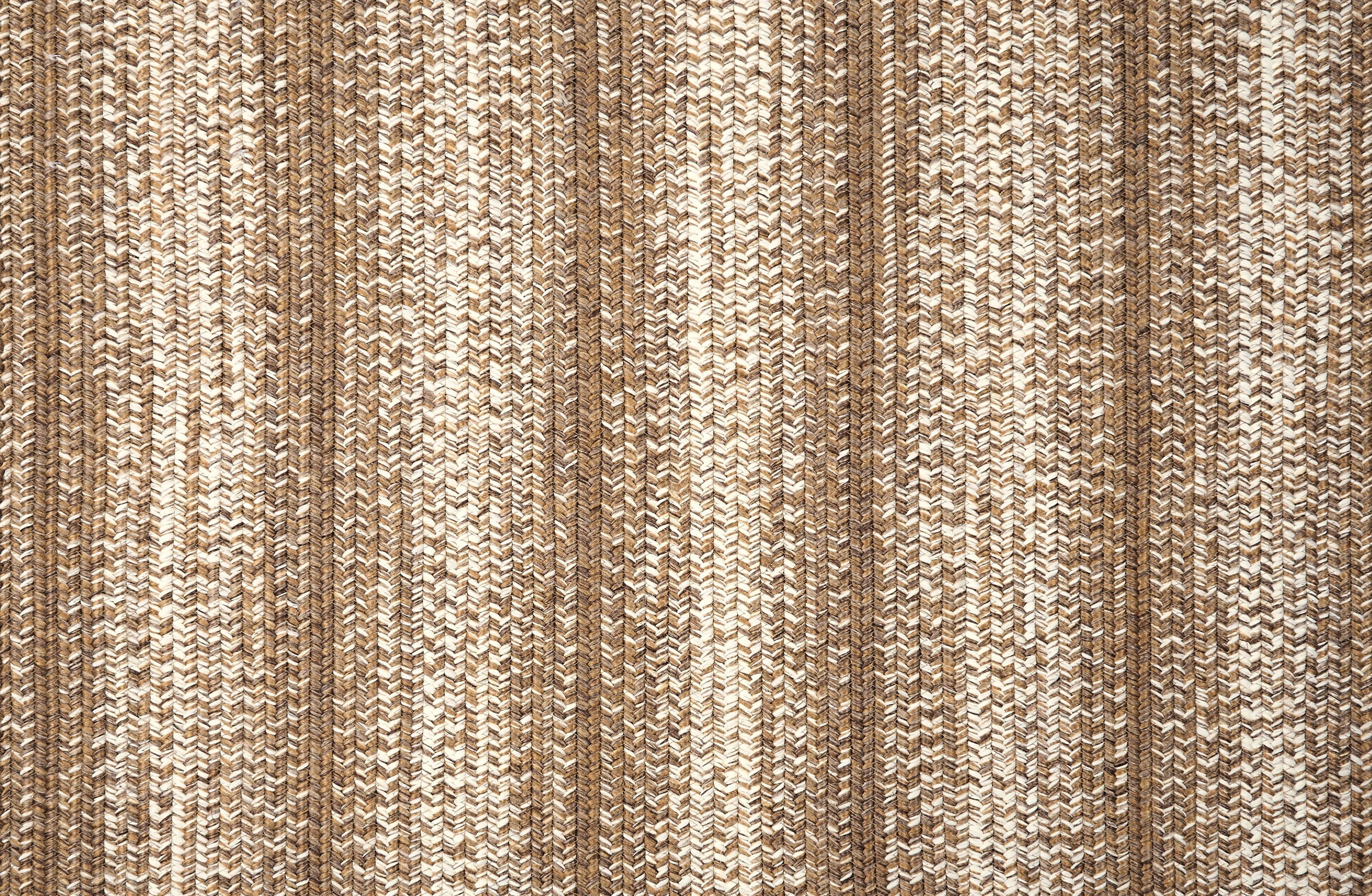 Broadloom carpet in a textural braided stripe in cream and taupe.