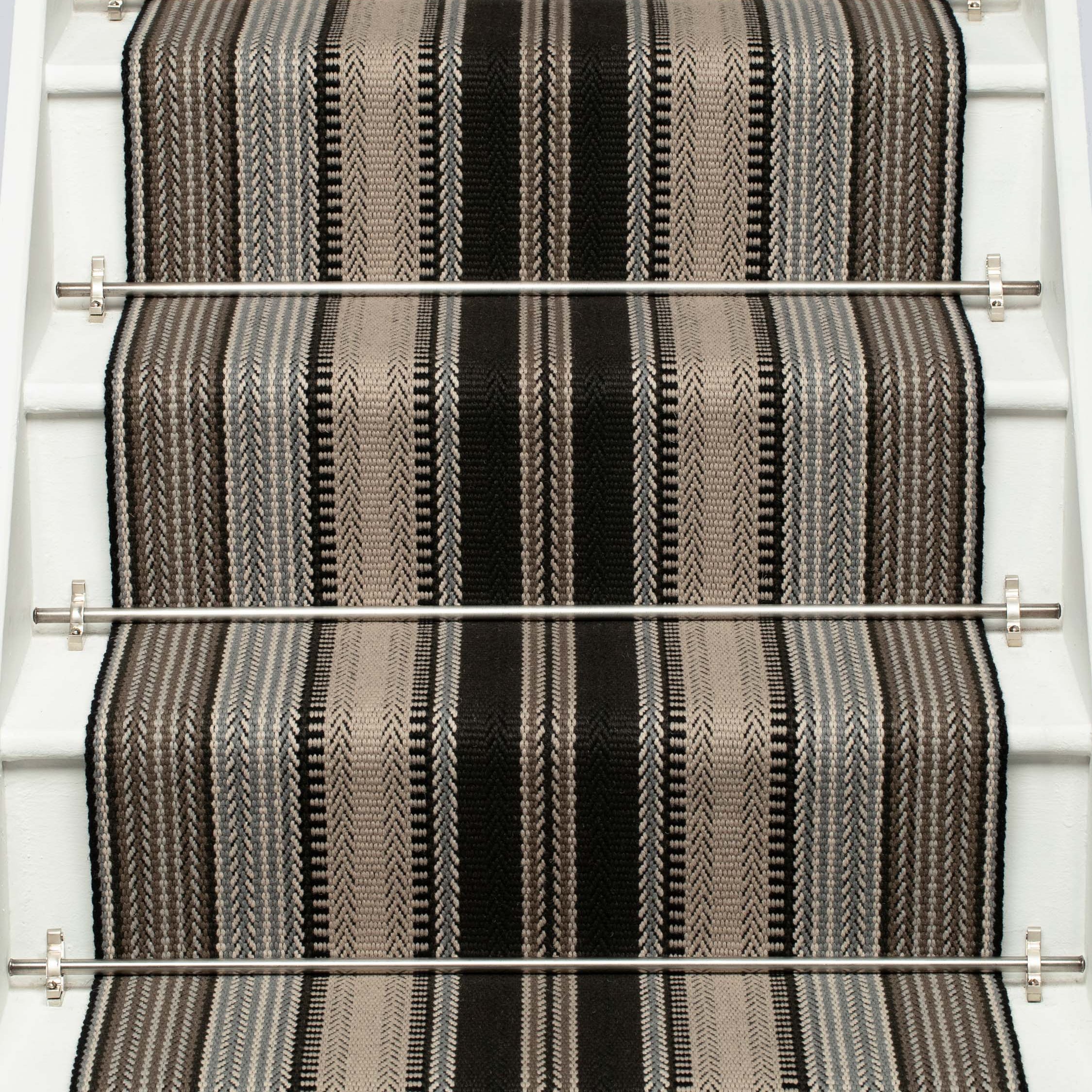 Striped flatweave runner in black white and grey on white staircase