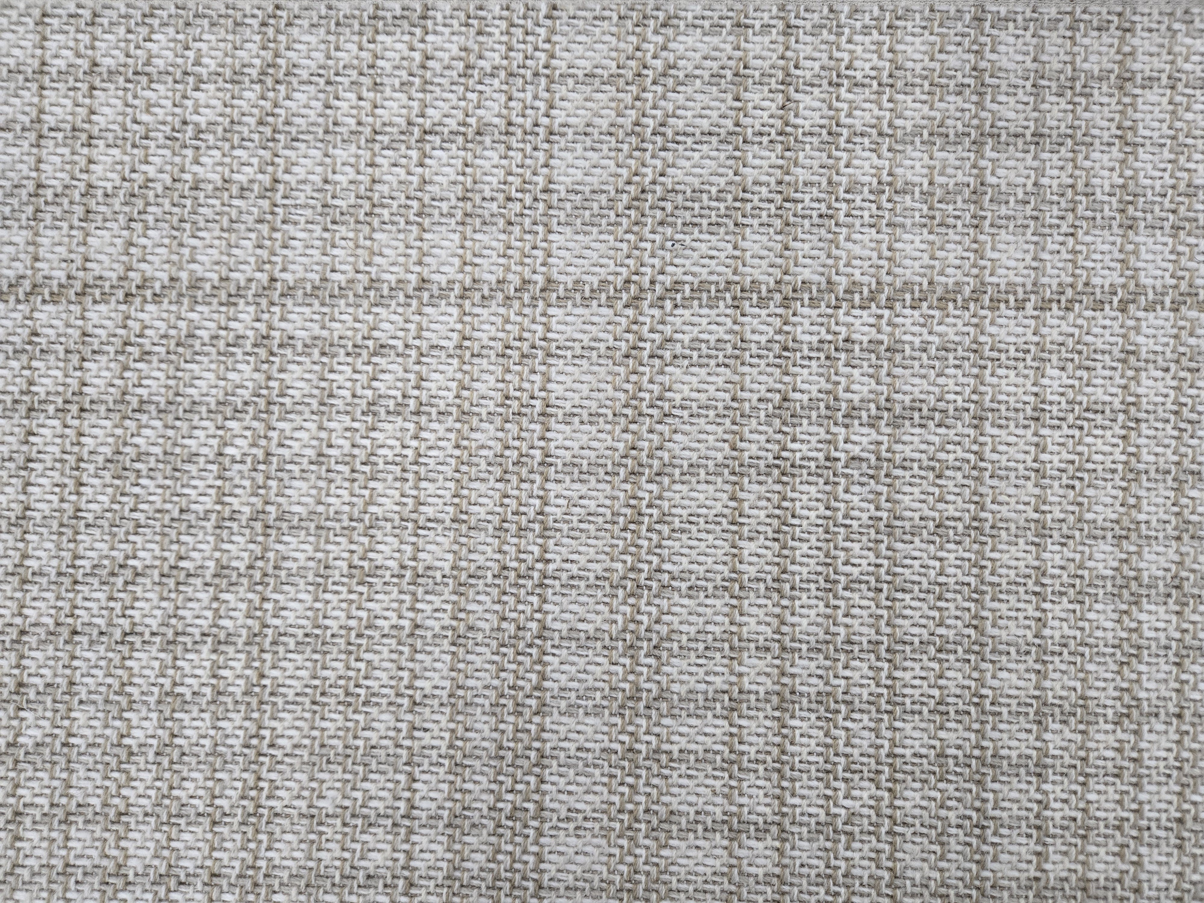 Broadloom carpet in a cream and tan plaid