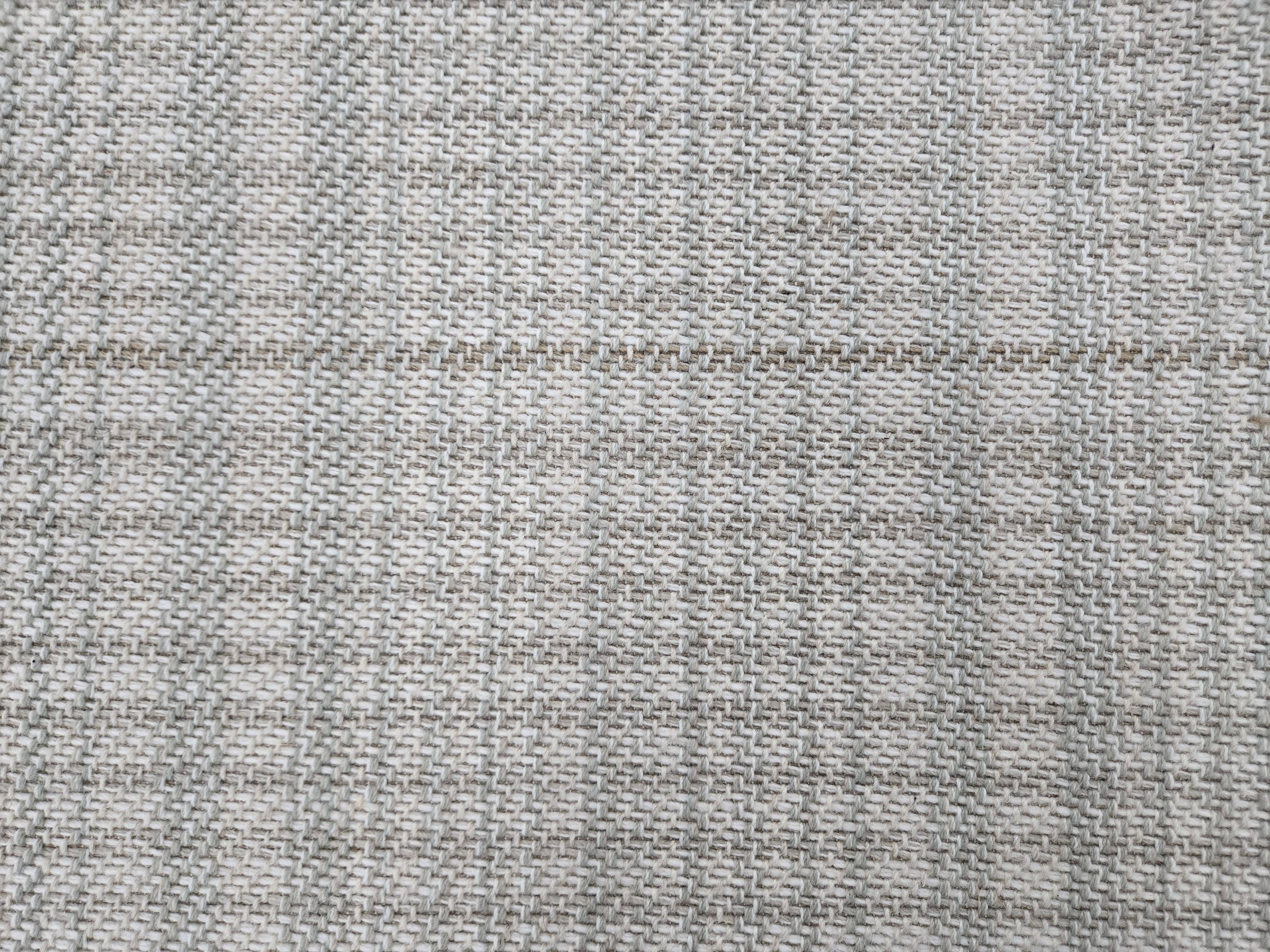 Broadloom carpet in a cream and grey.