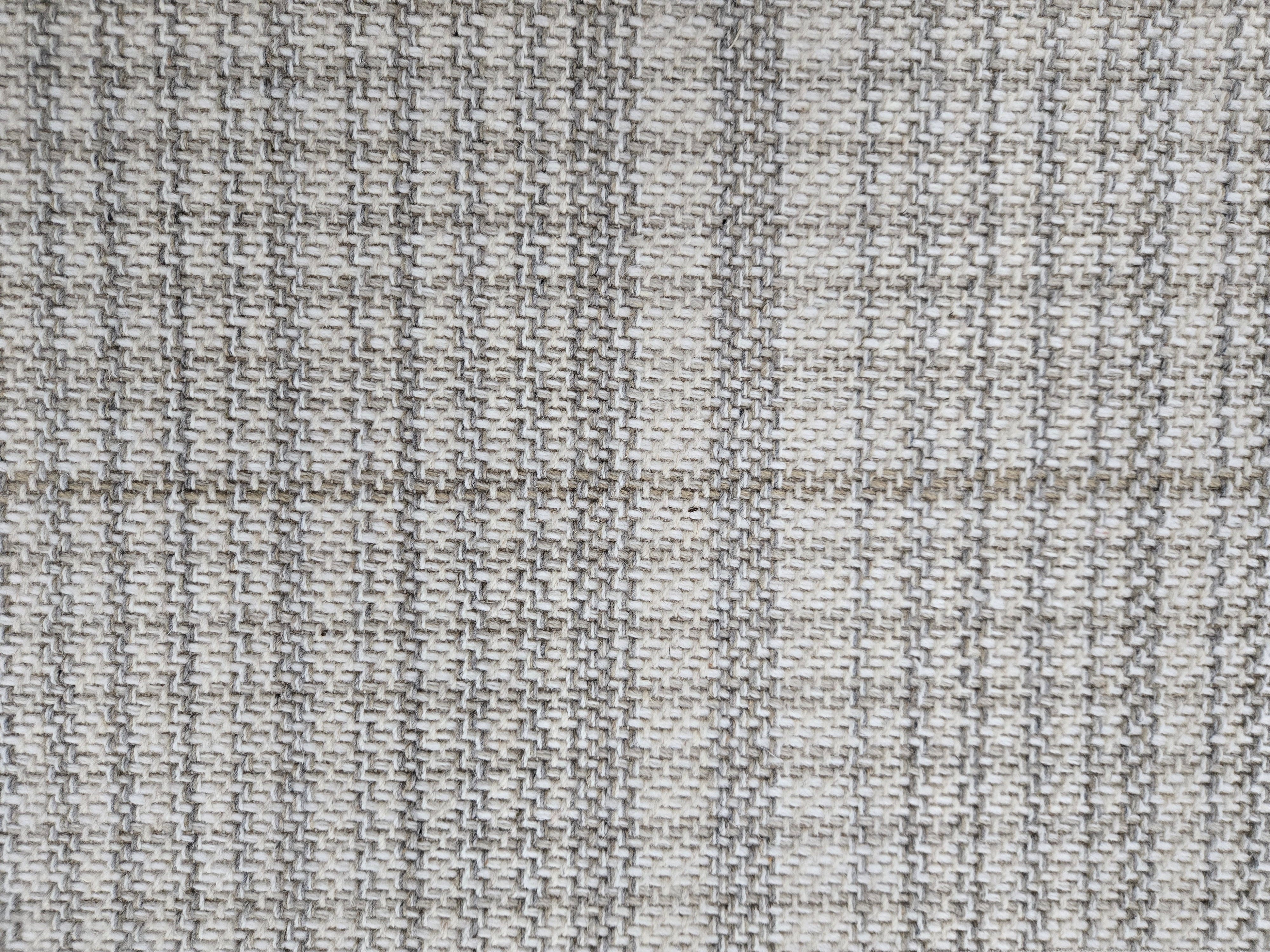 Broadloom carpet in a cream and steel