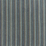 Detail of a hand-woven cotton fabric in an intricate grid pattern in shades of navy, brown, teal and white.
