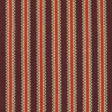Detail of a hand-woven cotton striped fabric in shades of red, brown and yellow.