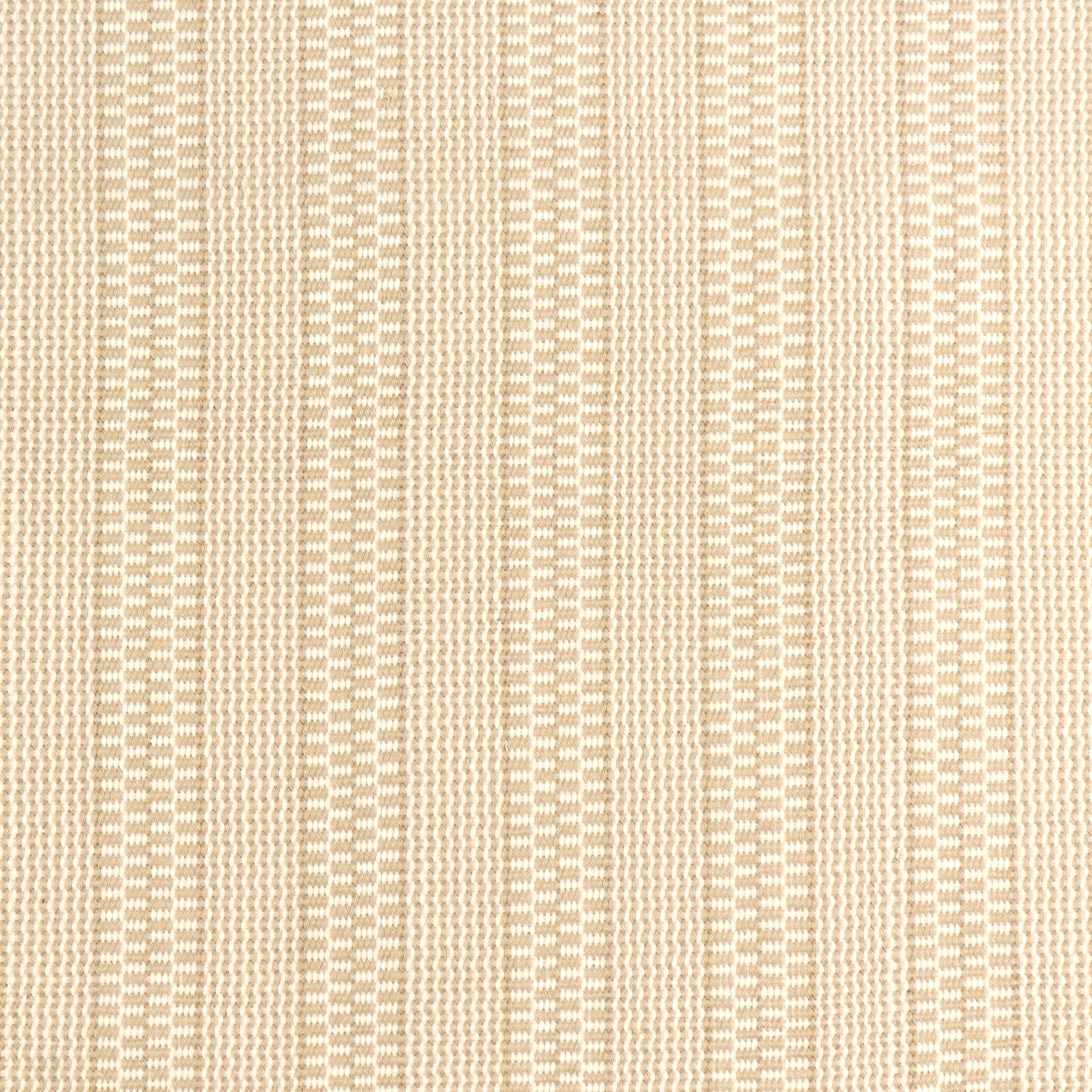 Detail of a hand-woven cotton fabric in a striped twill pattern in cream and white.