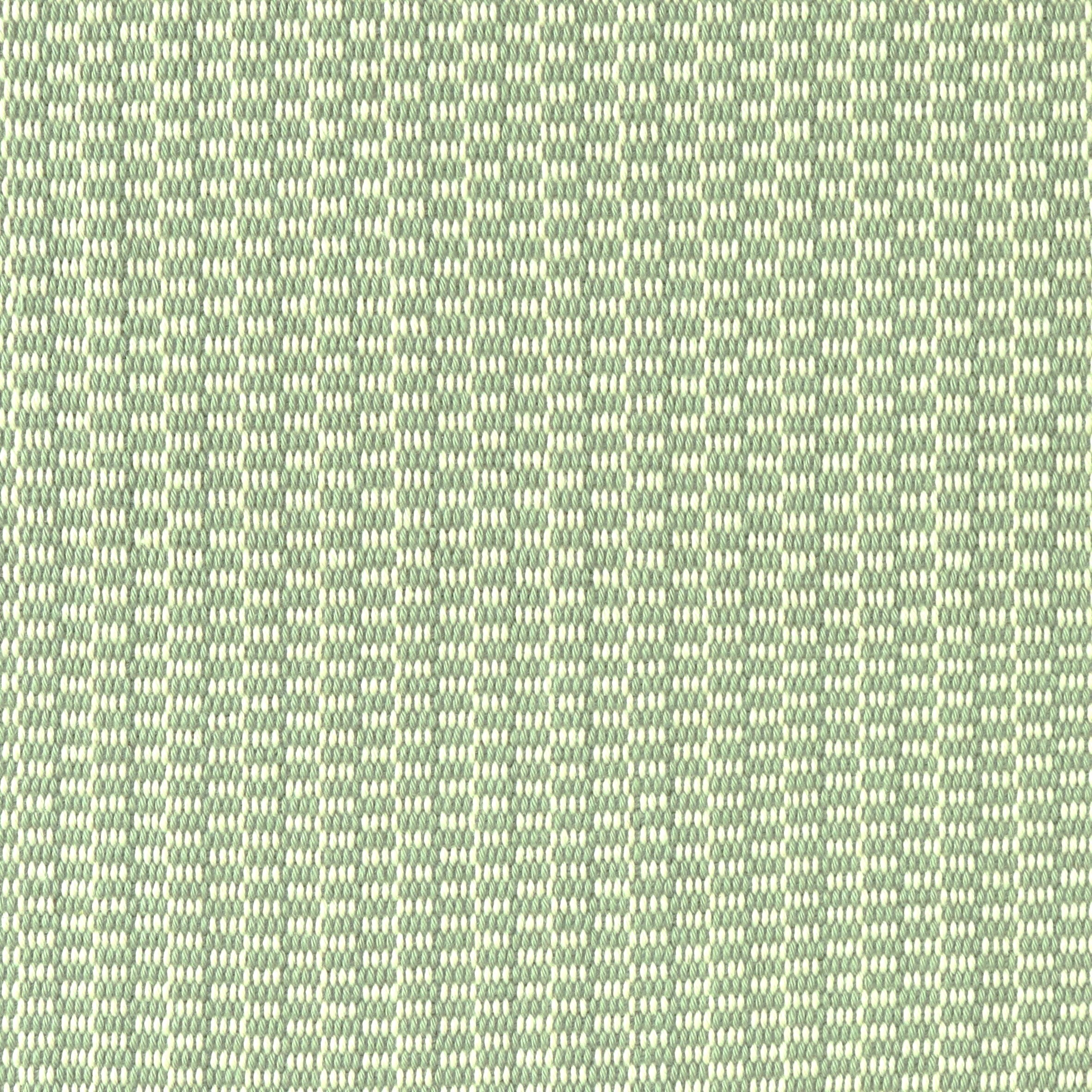Detail of a hand-woven cotton fabric in a grid pattern in sage and cream.
