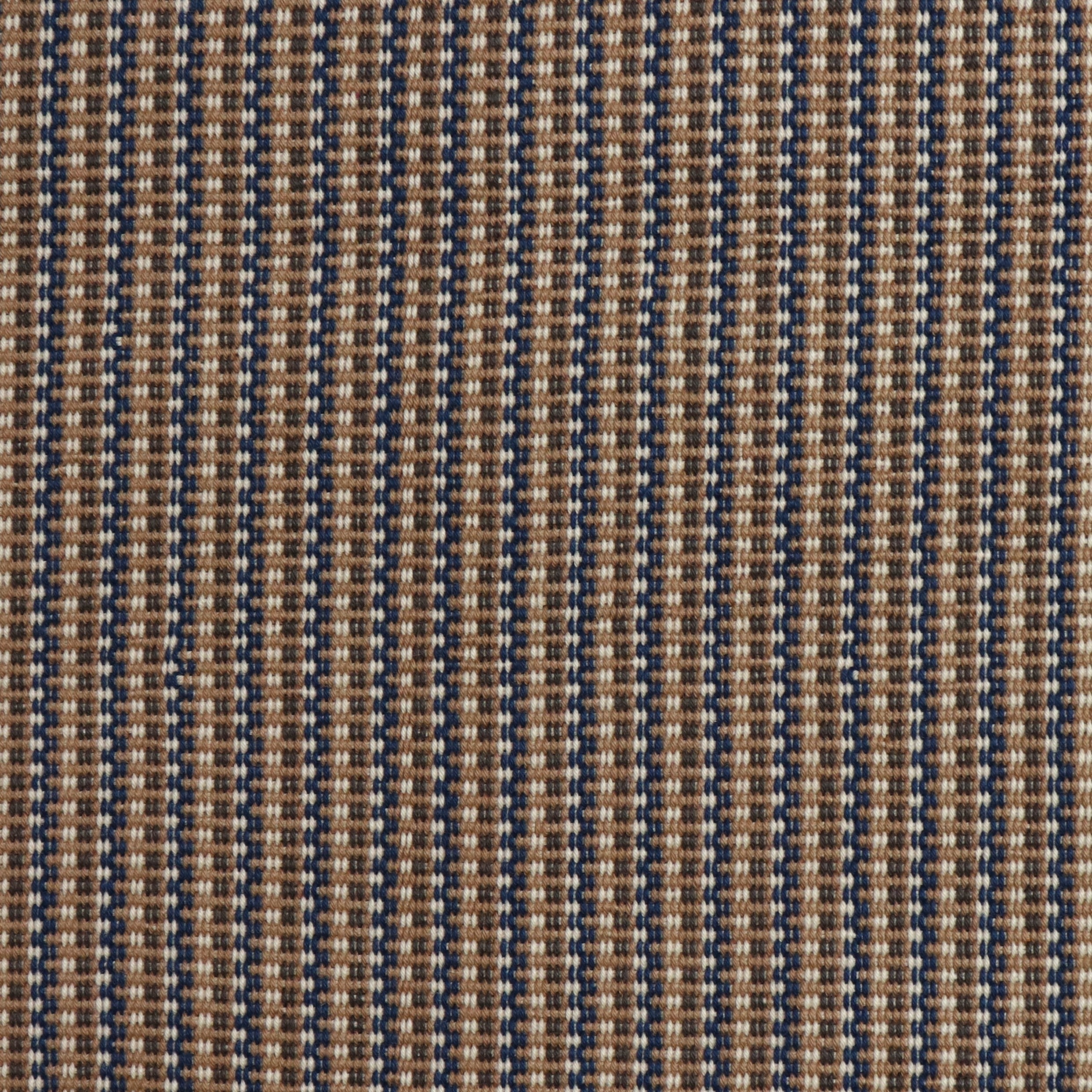 Detail of a hand-woven cotton fabric in an intricate grid pattern in shades of brown, navy and cream.