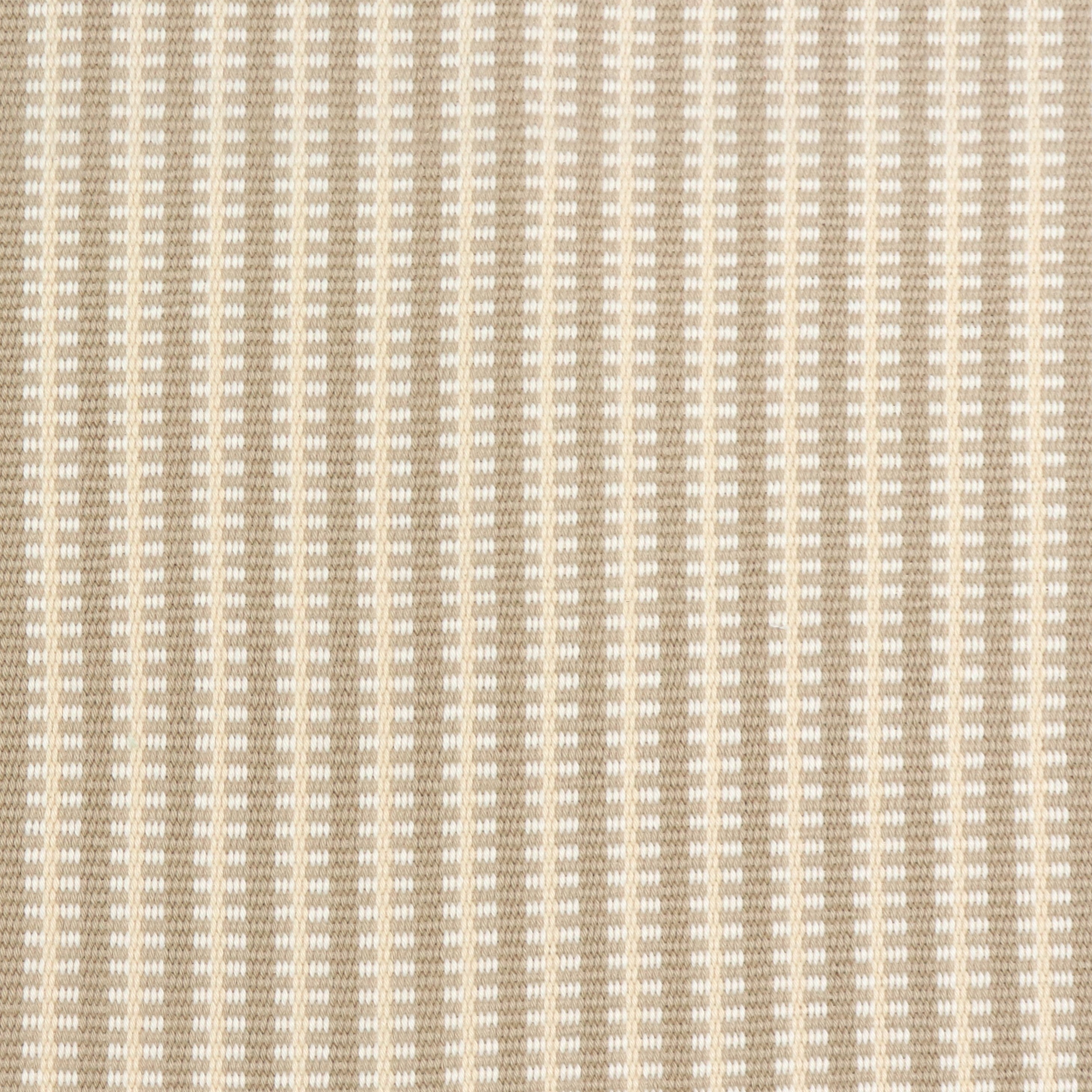 Detail of a hand-woven cotton fabric in an intricate gridded stripe pattern in shades of cream, tan and white.