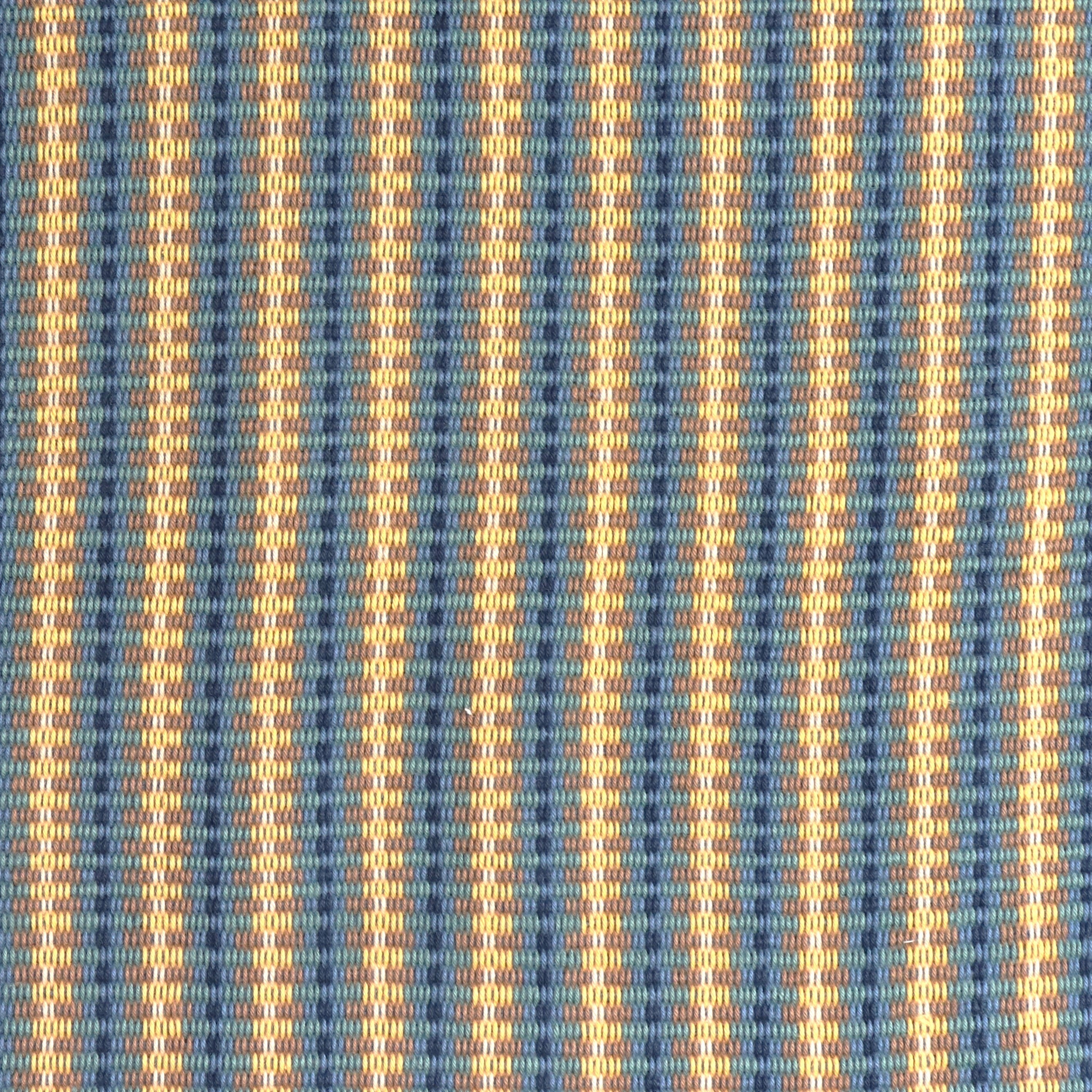 Detail of a hand-woven cotton fabric in an intricate stripe pattern in shades of blue, navy, tan and yellow.