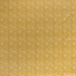 Printed linen fabric in a repeating chrysanthemum pattern in white on a mustard field.