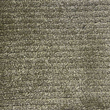 Broadloom carpet in a lightly ribbed cut pile in mossy green