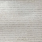 Broadloom carpet in a lightly ribbed cut pile in cool white. 