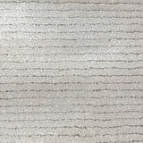 Broadloom carpet in a lightly ribbed cut pile in cool white. 