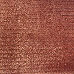 Broadloom carpet in a lightly ribbed cut pile in rust red. 
