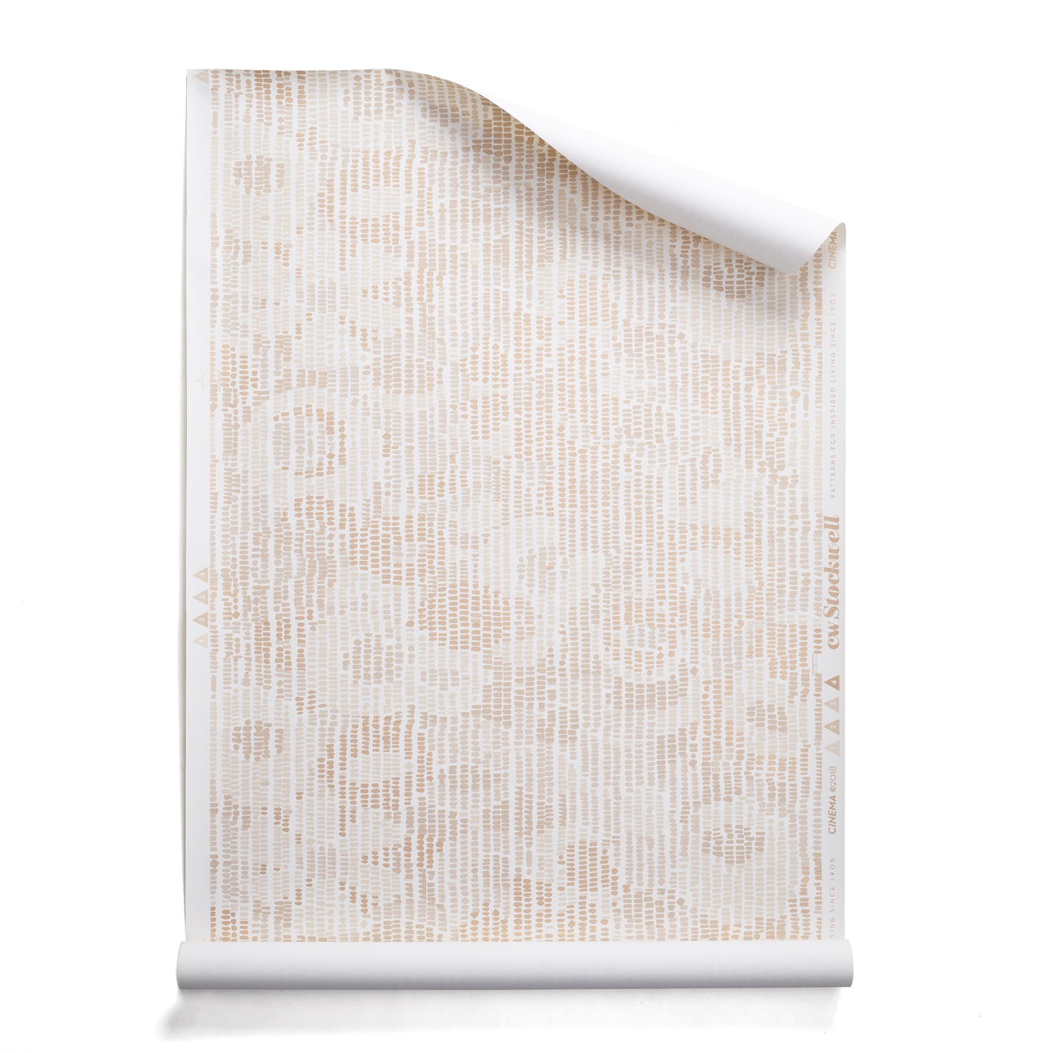 A roll of wallpaper with a pointillist abstract floral pattern in shades of beige on white. 
