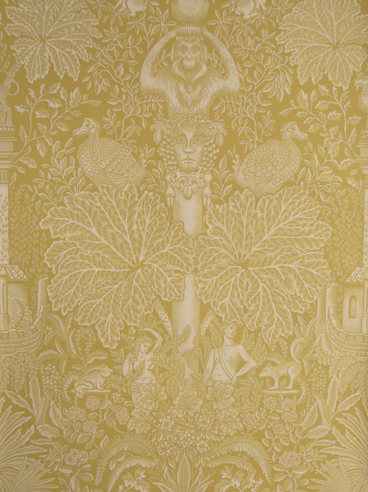 Decorative wallpaper with classical design elements on a gold background