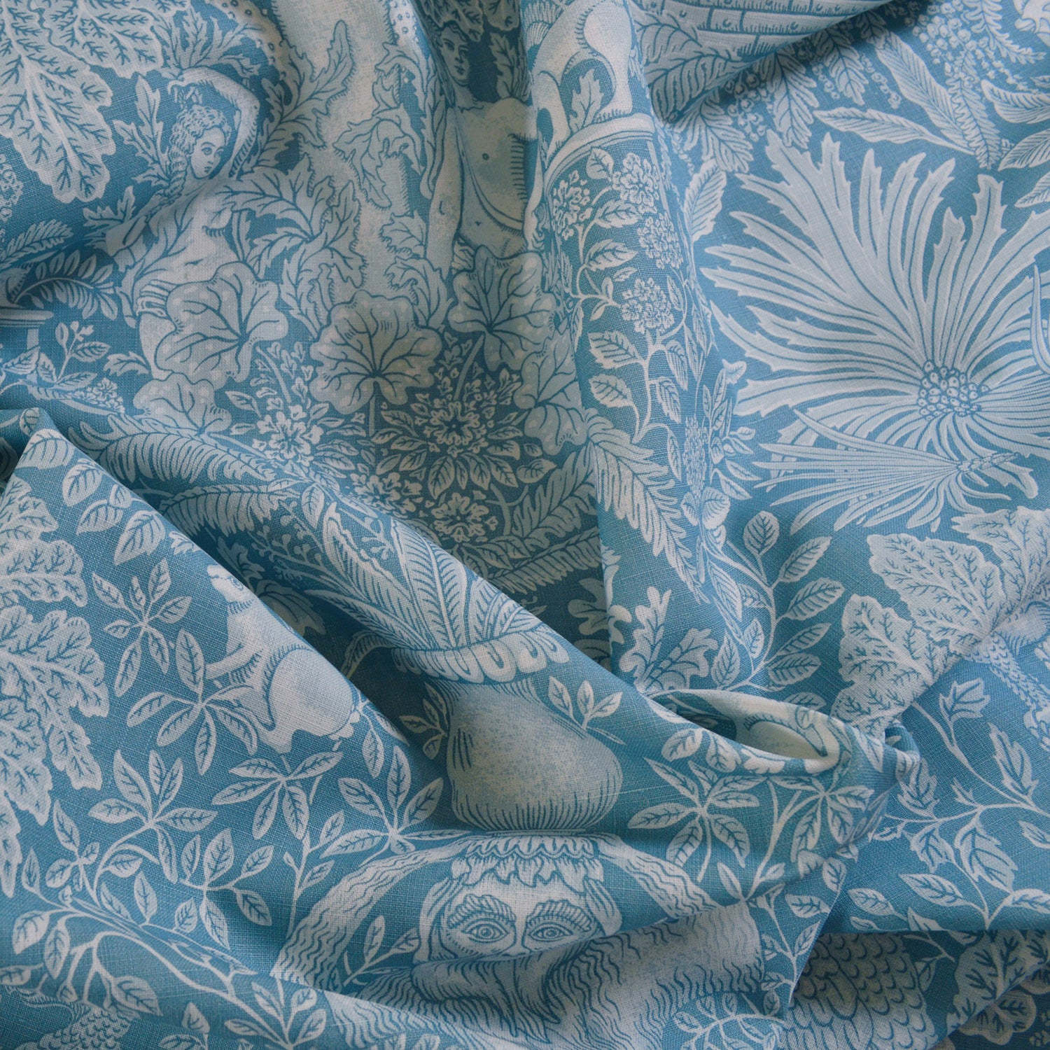 Blue fabric with white floral and leaf pattern